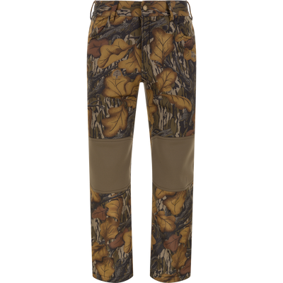 The Waterfowl Endurance Jean Cut Wader Pant in Mossy Oak Fall Foliage features fleece lining, solid brown knee patches, and a button waist closure—perfect mid-weight hunting pants for warmth and durability.