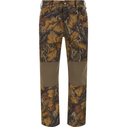 The Waterfowl Endurance Jean Cut Wader Pant in Mossy Oak Fall Foliage features fleece lining, solid brown knee patches, and a button waist closure—perfect mid-weight hunting pants for warmth and durability.