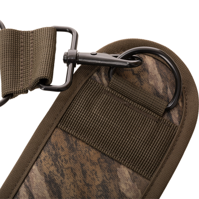 Close-up of the 3-Way Duck Tote's padded fabric strap with camo print, featuring a black metal hook and D-ring for versatile, comfortable carrying.