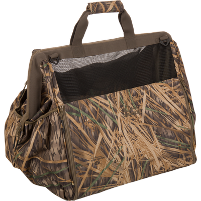 The Guardian Elite Wader Bag by Waterfowl in Mossy Oak Original Shadow Grass is a waterproof soft carrier with mesh ventilation, two top handles, and zippered pockets—perfect for carrying small animals.