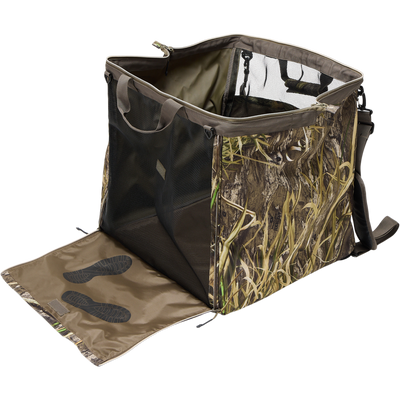 Guardian Elite Wader Bag, a portable, collapsible camo-patterned travel kennel with mesh sides, zip-down front flap, suitable for hunters transporting working dogs.