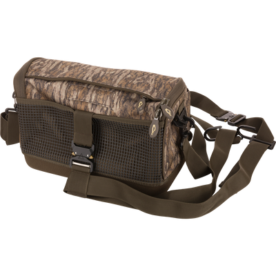 Tree Hugger Shoulder Bag with camo-style fabric, grid-mesh pocket, waterproof bottom, dual zippers, and adjustable strap, ideal for hunting or fishing gear.