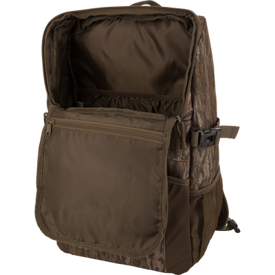 Drake Day Pack with unzipped main compartment, inner pockets visible. Features rugged, water-resistant material, ideal for hunting adventures and outdoor use.