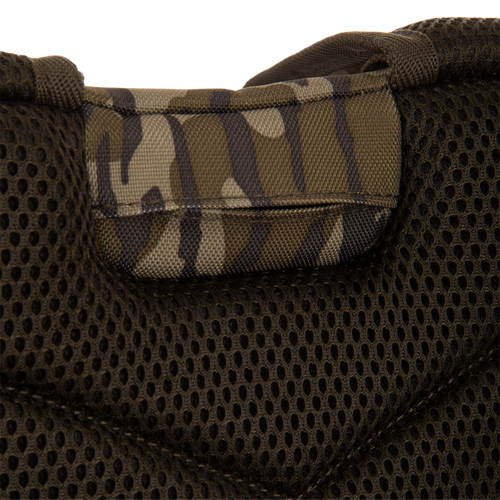 Close-up of the Tree Hugger Timber Day Pack's padded mesh back-panel with camouflage nylon handle, showcasing its rugged design for outdoor hunting adventures.