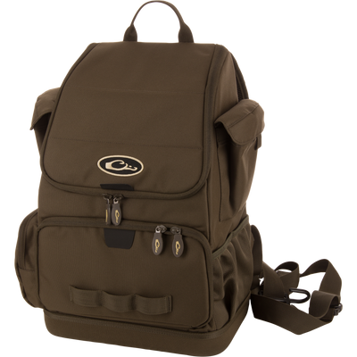 Tree Hugger Timber Day Pack with multiple pockets, adjustable straps, webbing loops, and a top carry handle, designed for durability and easy gear access during outdoor adventures.