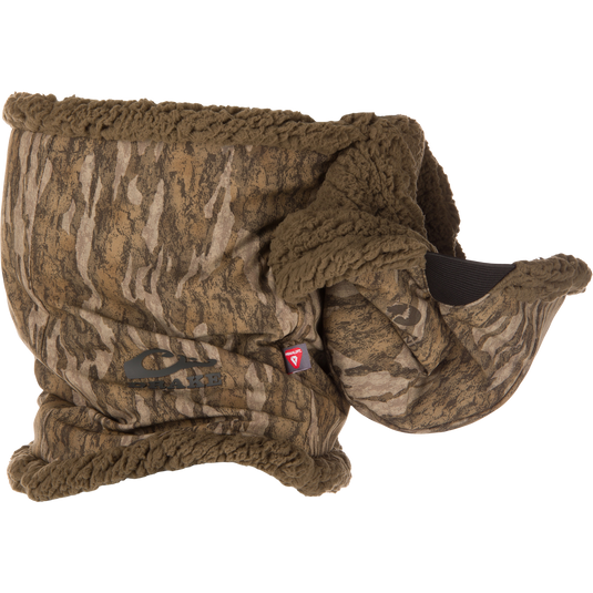 The LST BMF Balaclava with Primaloft by Waterfowl features brown camouflage-patterned sherpa fleece, a plush lining, and a logo patch—perfect for warmth and essential for cold-weather outdoor use.
