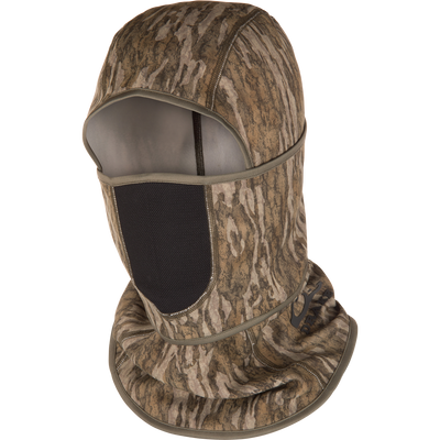 The Waterfowl MST Fleece Convertible Face Mask in Mossy Oak Bottomland is a stretch fleece camo balaclava with open face and mesh mouth cover, ideal for outdoor activities like hunting.