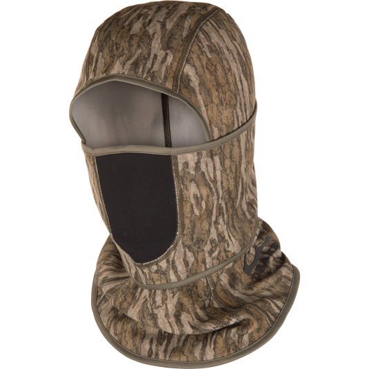 The Waterfowl MST Fleece Convertible Face Mask in Mossy Oak Bottomland is a stretch fleece camo balaclava with open face and mesh mouth cover, ideal for outdoor activities like hunting.