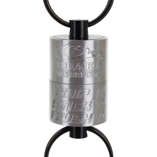 Drake Finisher Magnetic Retractor for waterfowl hunting, featuring two black rings and engravings that read Drake Waterfowl and Grip It Stick It Finish It.