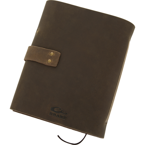 Drake Leather Wingshooters Hunting Log features a brown leather cover with brass snaps, embossed logo, and pen loop, ideal for documenting detailed hunting experiences.