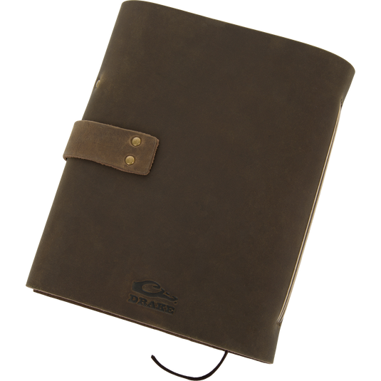 Drake Leather Wingshooters Hunting Log features a brown leather cover with brass snaps, embossed logo, and pen loop, ideal for documenting detailed hunting experiences.