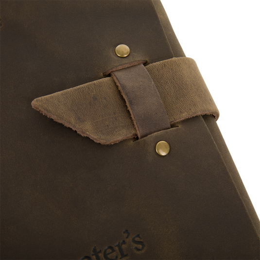 Close-up of Drake Leather Wingshooters Hunting Log, featuring distressed leather cover with embossed lettering and a brass snap, designed for detailed hunting record-keeping.