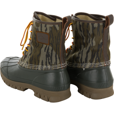 Throwback 80 Waxed Canvas Lace Up Duck Boot with camo canvas upper, waterproof rubber base, and orange-yellow laces, designed for durability and comfort in rugged outdoor conditions.