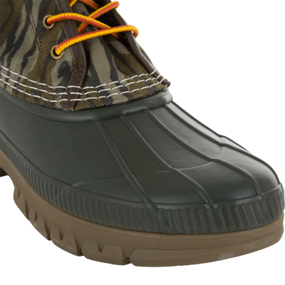 Throwback 80 Waxed Canvas Lace Up Duck Boot with camo-patterned upper, orange-and-yellow laces, and waterproof rubber bottom, ideal for rugged outdoor wear.