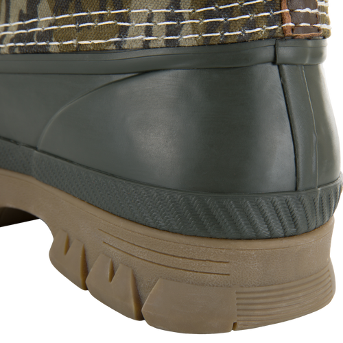 RTL - Throwback 80 Waxed Canvas Slip On Duck Boot, highlighting its waterproof rubber sole and camo-patterned fabric cuff, ideal for rugged outdoor performance.