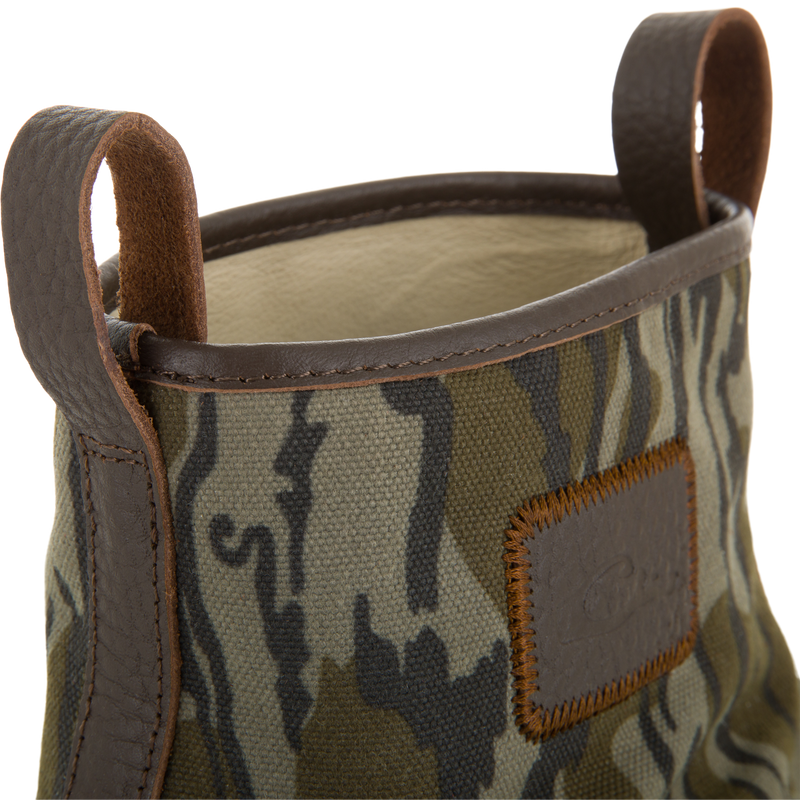 RTL - Throwback 80 Waxed Canvas Slip On Duck Boot with camouflage-patterned fabric, dark brown leather trim, and pull loops, designed for durability and water resistance.