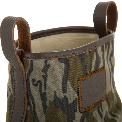 RTL - Throwback 80 Waxed Canvas Slip On Duck Boot with camouflage-patterned fabric, dark brown leather trim, and pull loops, designed for durability and water resistance.