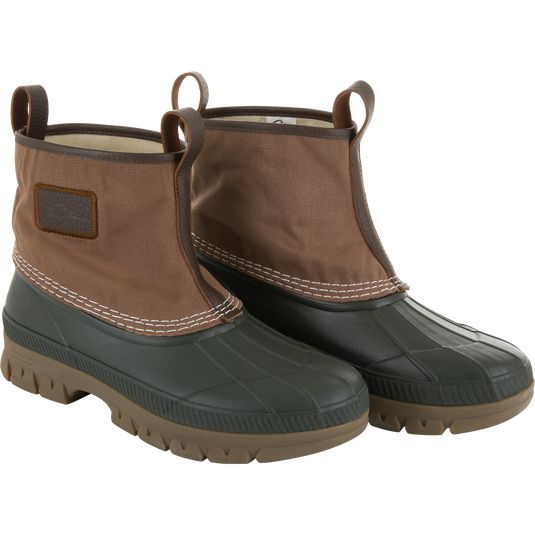 RTL - Throwback 80 Waxed Canvas Slip On Duck Boot, featuring a black rubber sole and brown canvas upper with leather trim and pull-on loops for durability.