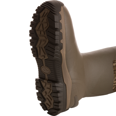 BMF1600 17 Rubber Boot's outsole with aggressive lug tread, showcasing olive-brown waterproof sidewall. Ideal for durability, insulation, and comfort in rugged environments.