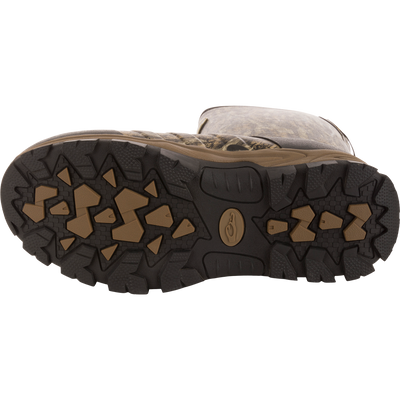 Underside view of EST Uninsulated 16 Hybrid Mudder Boot 3.0, showcasing heavy-tread rubber outsole with angular lugs for traction on rough terrain.