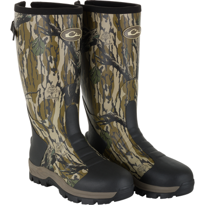 The Waterfowl EST Uninsulated 16″ Hybrid Mudder Boot 3.0 in Mossy Oak Original Treestand features rugged soles and black toe caps, perfect for outdoor use.