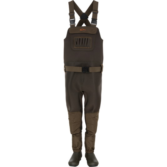 Waterfowl Youth Neoprene Wader in Green Timber shown upright against a white background, featuring adjustable suspenders and belt, front zip pocket, and built-in booties.