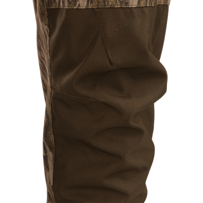 Hardline Uninsulated Breathable Wader featuring reinforced ballistic fabric with camouflage panels, showcasing the textured knee area, ideal for outdoor and hunting adventures.