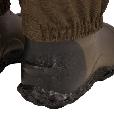 Close-up of the Hardline Breathable Youth Wader's boot and pant cuff, highlighting its waterproof, breathable design with reinforced materials for durability.