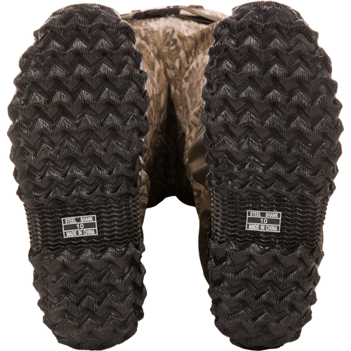 Underside view of Hardline Insulated Breathable Wader boots showing camo-pattern, zig-zag tread, and STEEL SHANK 10 MADE IN CHINA label.