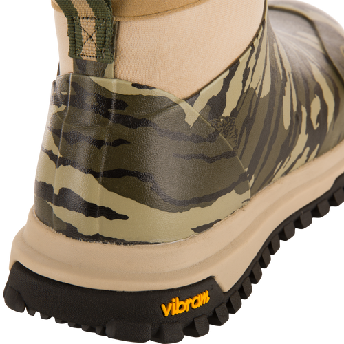 Offroad Rubber Deck Boots featuring a camouflage pattern, with a tan midsole, rugged black Vibram outsole, and slip-on design with a pull-tab and elastic side panel.