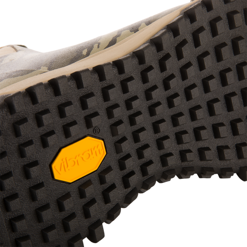 Close-up of Offroad Rubber Deck Boots' black outsole, featuring square lugs and yellow Vibram logo, highlighting durability and grip for demanding waterfowl conditions.