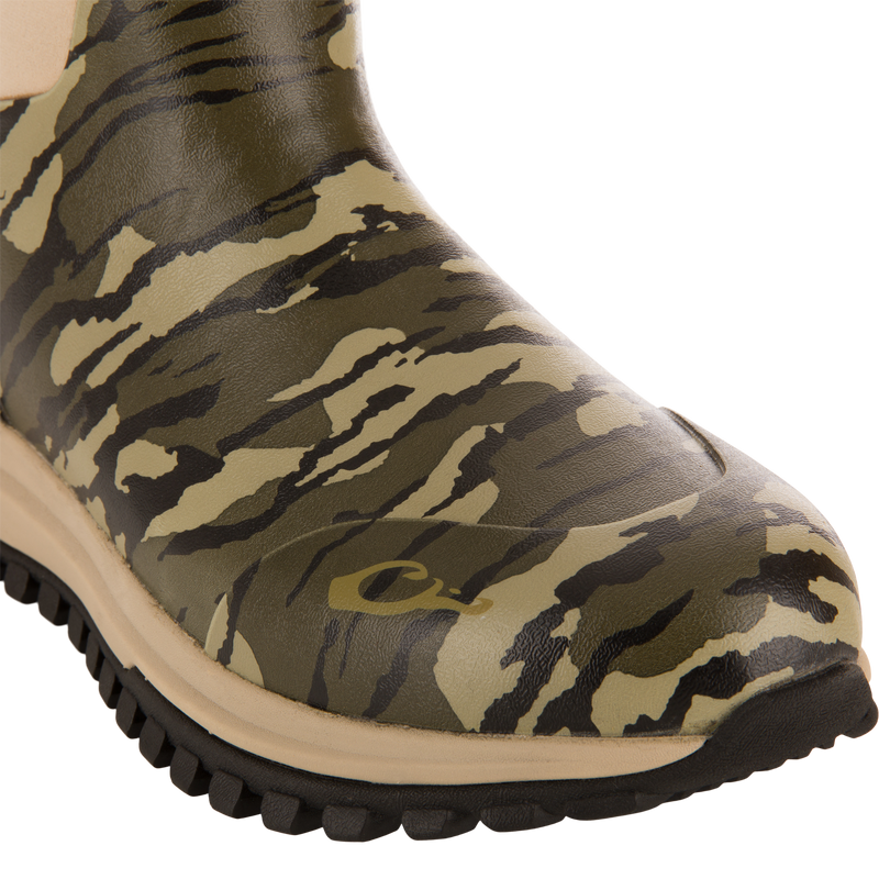 Close-up of Offroad Rubber Deck Boots' camouflage-patterned toe, featuring lugged sole, designed for waterfowl hunting with waterproof construction and Vibram® outsole.