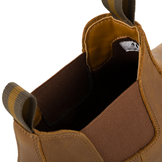 Close-up of the opening of a Lifestyle Leather Camp Deck Boot with brown elastic side panels and striped pull tabs.