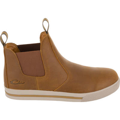 Lifestyle Leather Camp Deck Boot in brown leather, featuring a Chelsea style with elastic side panels, pull tabs, and a textured rubber sole.