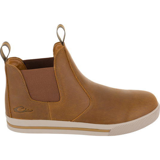 Lifestyle Leather Camp Deck Boot in brown leather, featuring a Chelsea style with elastic side panels, pull tabs, and a textured rubber sole.