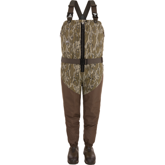 A pair of Hybrid Insulated Guardian Elite HND Front Zip Wader by Waterfowl in Mossy Oak Original Bottomland, featuring shoulder straps, a front zipper, and attached boots, displayed against a white background.