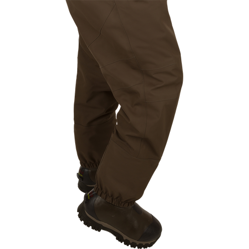 Insulated Guardian Elite HND Front Zip Wader - Brown, featuring durable 4-layer and 5-layer fabrics, reinforced seams, and a Thinsulate® boot lining for warmth and comfort.