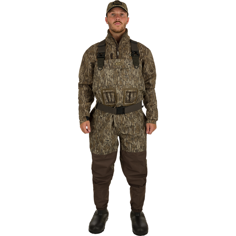 A man wearing Uninsulated Guardian Elite Vanguard Breathable Waders, standing facing front.