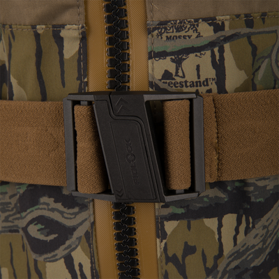 Close-up of BMF1600 Kevlar Wader with Primaloft's brown elastic belt featuring a black FIDLOCK buckle fastened over camo-patterned fabric with treestand™ branding.