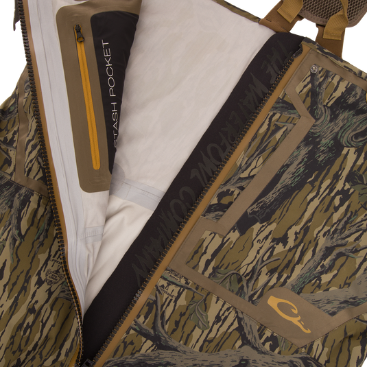 Close-up of the BMF1600 Kevlar Wader with Primaloft showing the interior stash pocket, camo fabric, and YKK™ Aquaseal® waterproof zipper, highlighting advanced design features.
