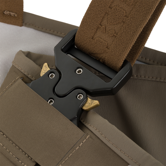 Close-up of a brown strap attached to a black tactical buckle on Drake X Ducks Unlimited BMF1600 Kevlar Wader waterproof waders.