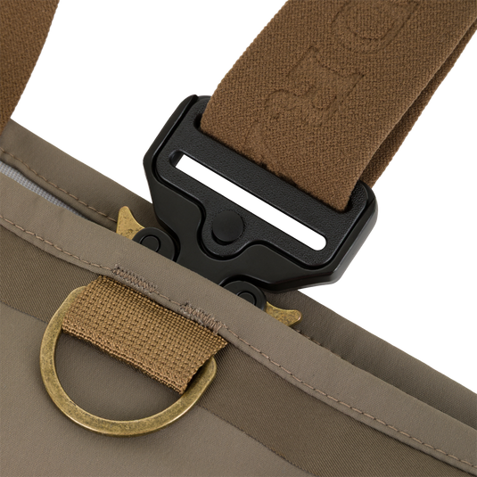 Close-up of a brown Drake X Ducks Unlimited BMF1600 Kevlar Wader strap attached to a black buckle and a brass D-ring.