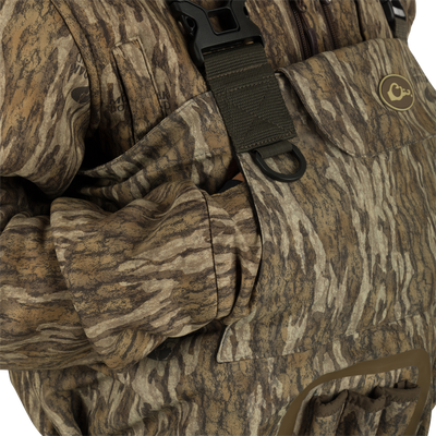 A close up of the Insulated Guardian Elite Vanguard Breathable Waders featuring pass-through internal handwarmer pockets to keep your hands warm and protected on even the coldest days.