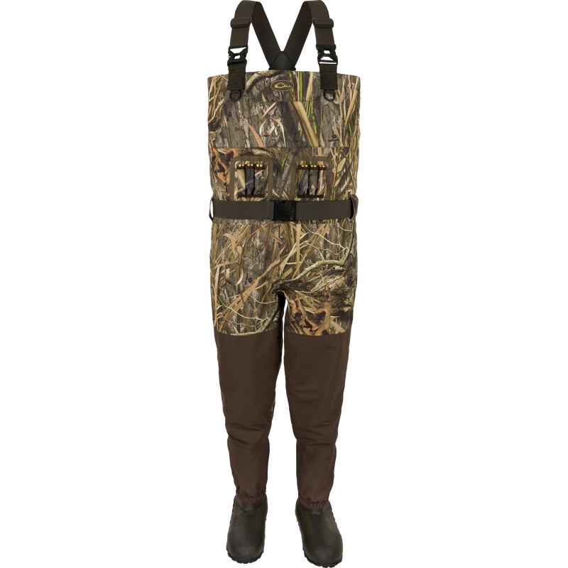 Insulated Guardian Elite Vanguard Breathable Waders with built-in boots, camo bib, adjustable straps, and utility pockets, designed for waterproof hunting and fishing.