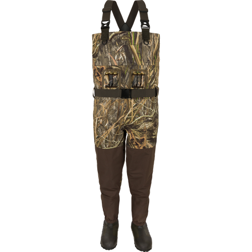 Insulated Guardian Elite Vanguard Breathable Waders with built-in boots, camo bib, adjustable straps, and utility pockets, designed for waterproof hunting and fishing.