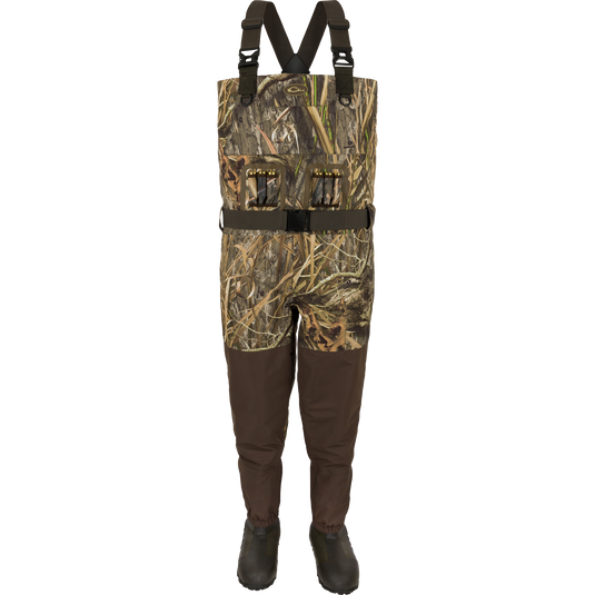 Insulated Guardian Elite Vanguard Breathable Waders with built-in boots, camo bib, adjustable straps, and utility pockets, designed for waterproof hunting and fishing.
