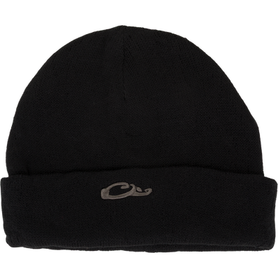 The LST Rib-Knit Stocking Cap by Waterfowl is a black acrylic beanie with a folded brim, featuring a small gray embroidered wave and Drake duck head logo on the front center for subtle style.