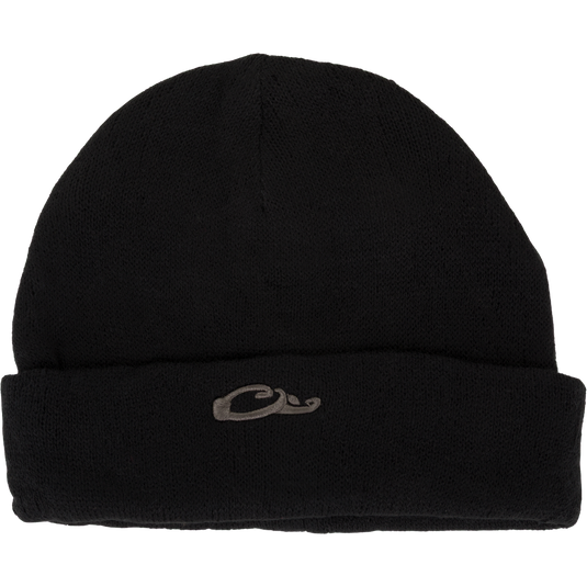 The LST Rib-Knit Stocking Cap by Waterfowl is a black acrylic beanie with a folded brim, featuring a small gray embroidered wave and Drake duck head logo on the front center for subtle style.