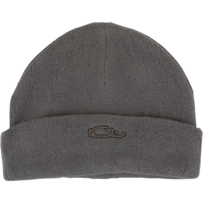 The Waterfowl LST Rib-Knit Stocking Cap is a gray acrylic beanie with a roll-up design, folded brim, and a small embroidered whale logo on the front.
