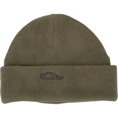The Waterfowl LST Rib-Knit Stocking Cap is an olive green acrylic beanie with a folded brim and a small, dark embroidered stylized “C” logo on the front in classic roll-up style.